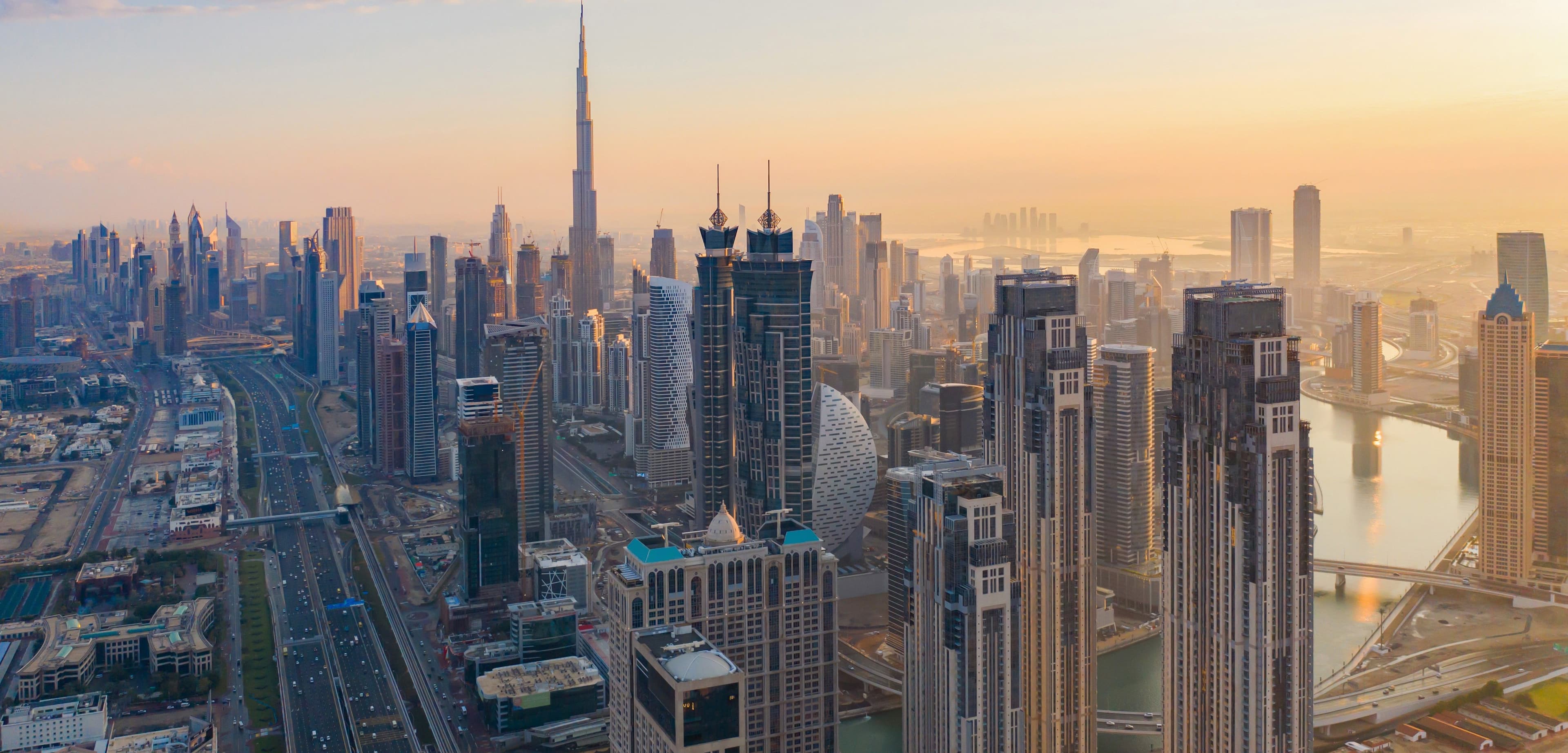 Dubai Property Market 2026 aerial skyline view at sunrise with Burj Khalifa