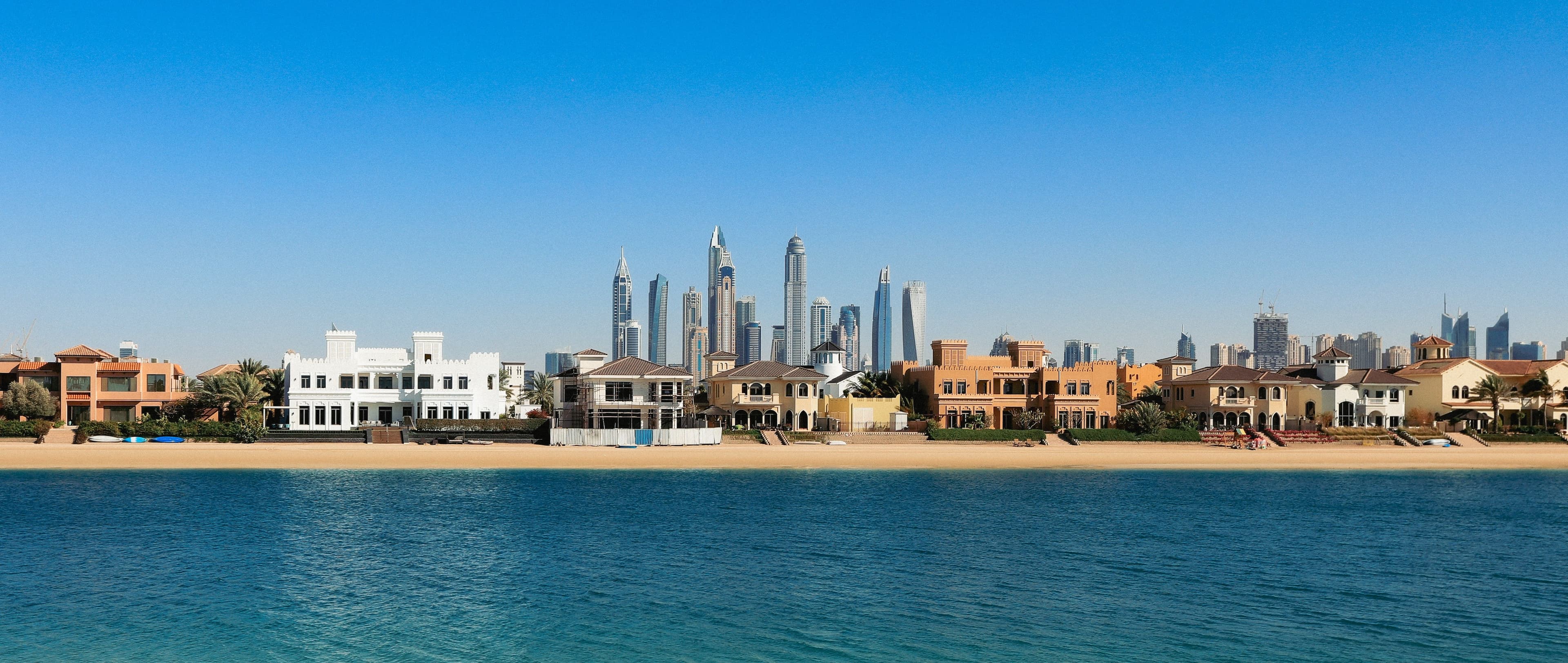 Luxury waterfront villas and Dubai Marina skyline reflecting trends in the UAE Property Market Q1 2026.